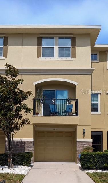 5529 White Marlin Court New Port Richey, FL 34652 - Photo 2 of 63 a front view of a house with a garage