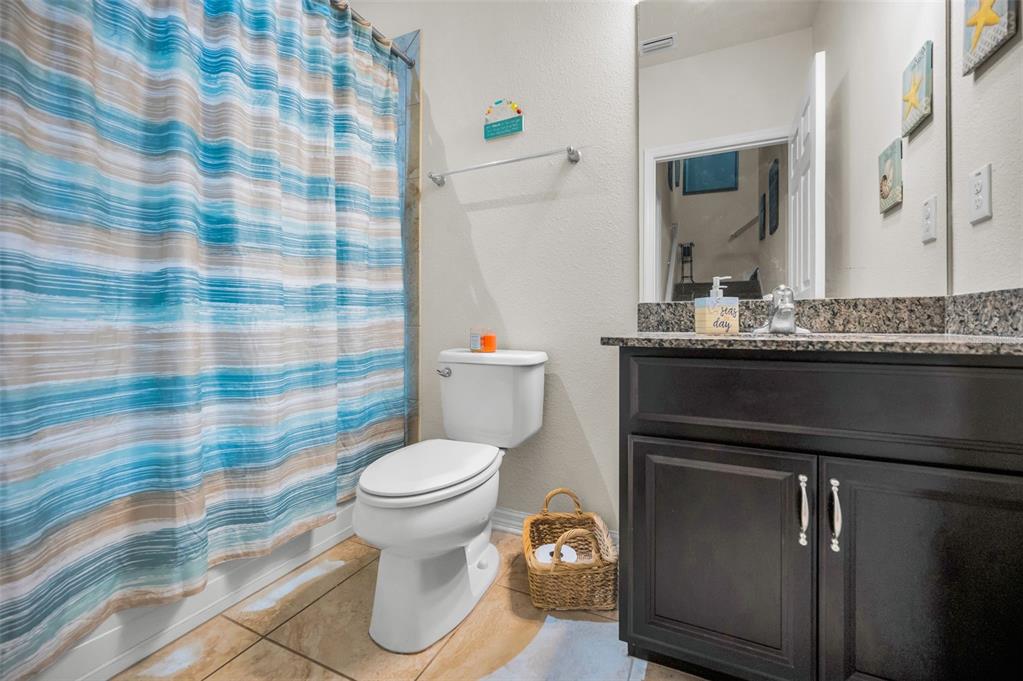 5529 White Marlin Court New Port Richey, FL 34652 - Photo 33 of 63 a bathroom with a sink toilet and shower