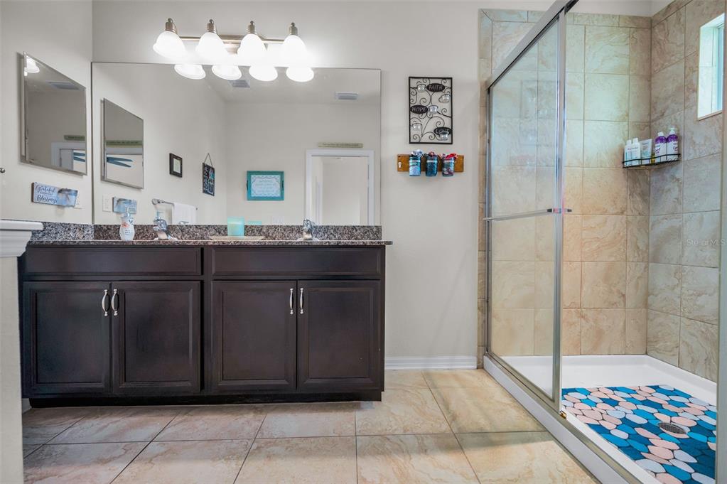 5529 White Marlin Court New Port Richey, FL 34652 - Photo 39 of 63 a bathroom with a sink a vanity and a mirror