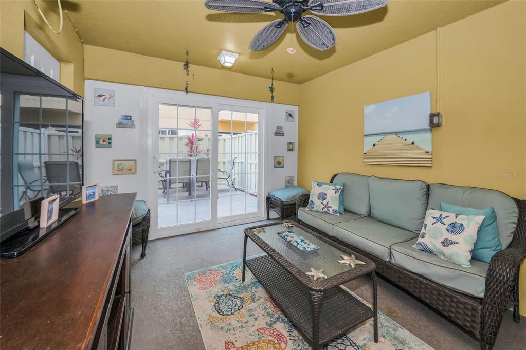 5529 White Marlin Court New Port Richey, FL 34652 - Photo 7 of 63 a living room with furniture and a chandelier