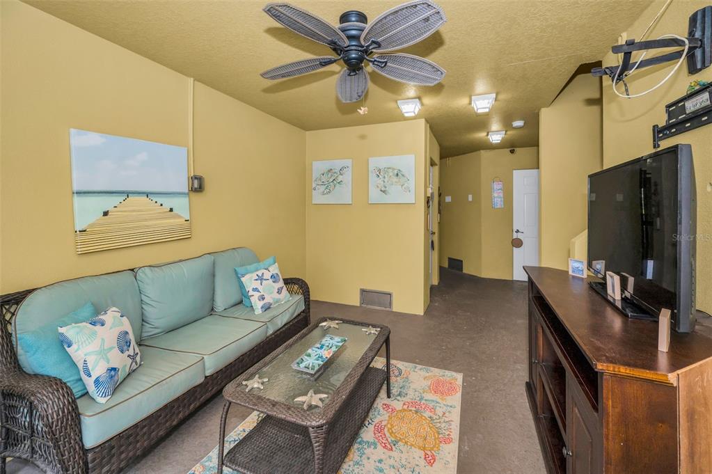 5529 White Marlin Court New Port Richey, FL 34652 - Photo 9 of 63 a living room with furniture and a flat screen tv
