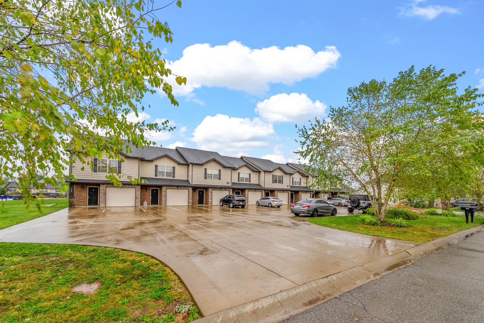 133 Melbourne Drive, Unit E Clarksville, TN 37043 - Photo 1 of 16 a view of a yard with a house in the background