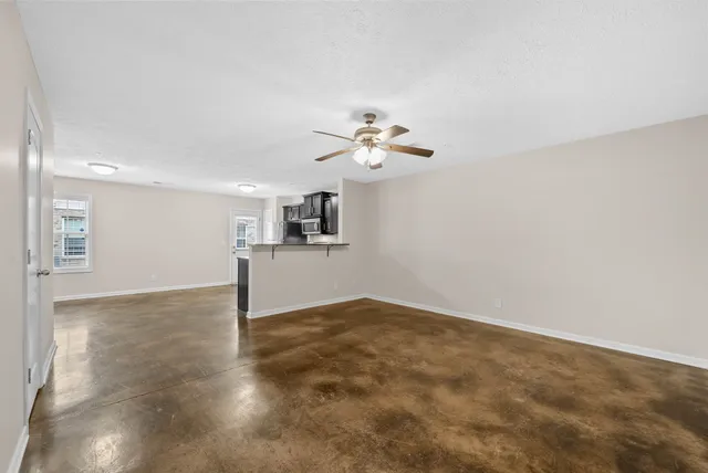 a view of a kitchen with a sink cabinetry and a chandelier