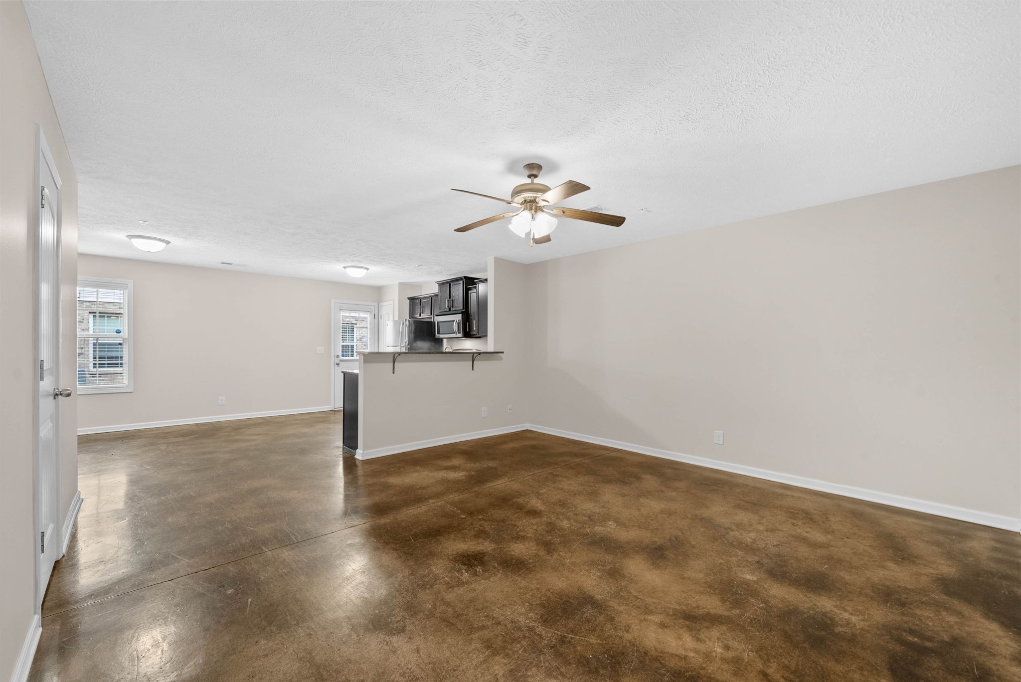 133 Melbourne Drive, Unit E Clarksville, TN 37043 - Photo 4 of 16 a view of a kitchen with a sink cabinetry and a chandelier