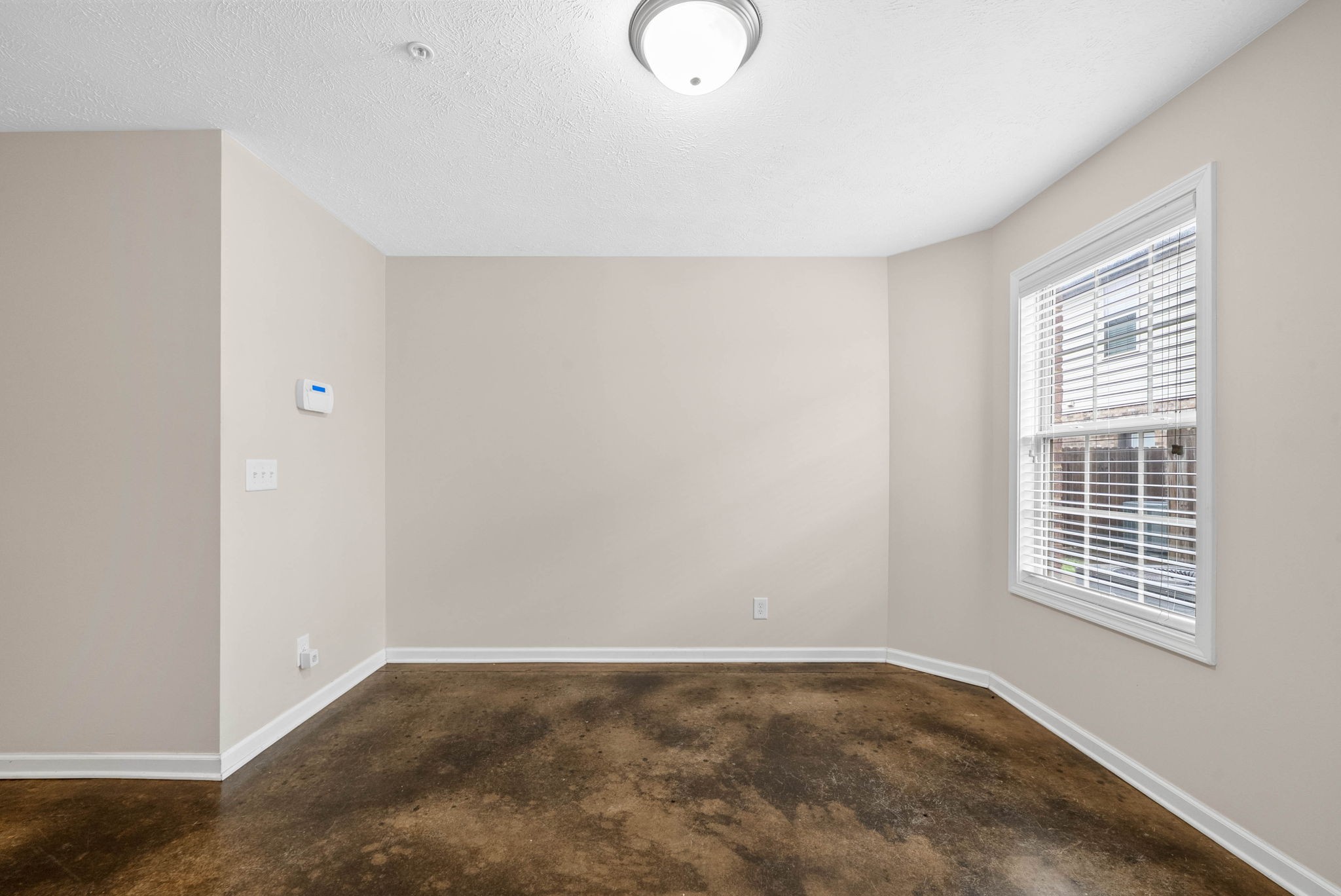133 Melbourne Drive, Unit E Clarksville, TN 37043 - Photo 7 of 16 a view of an empty room with a window