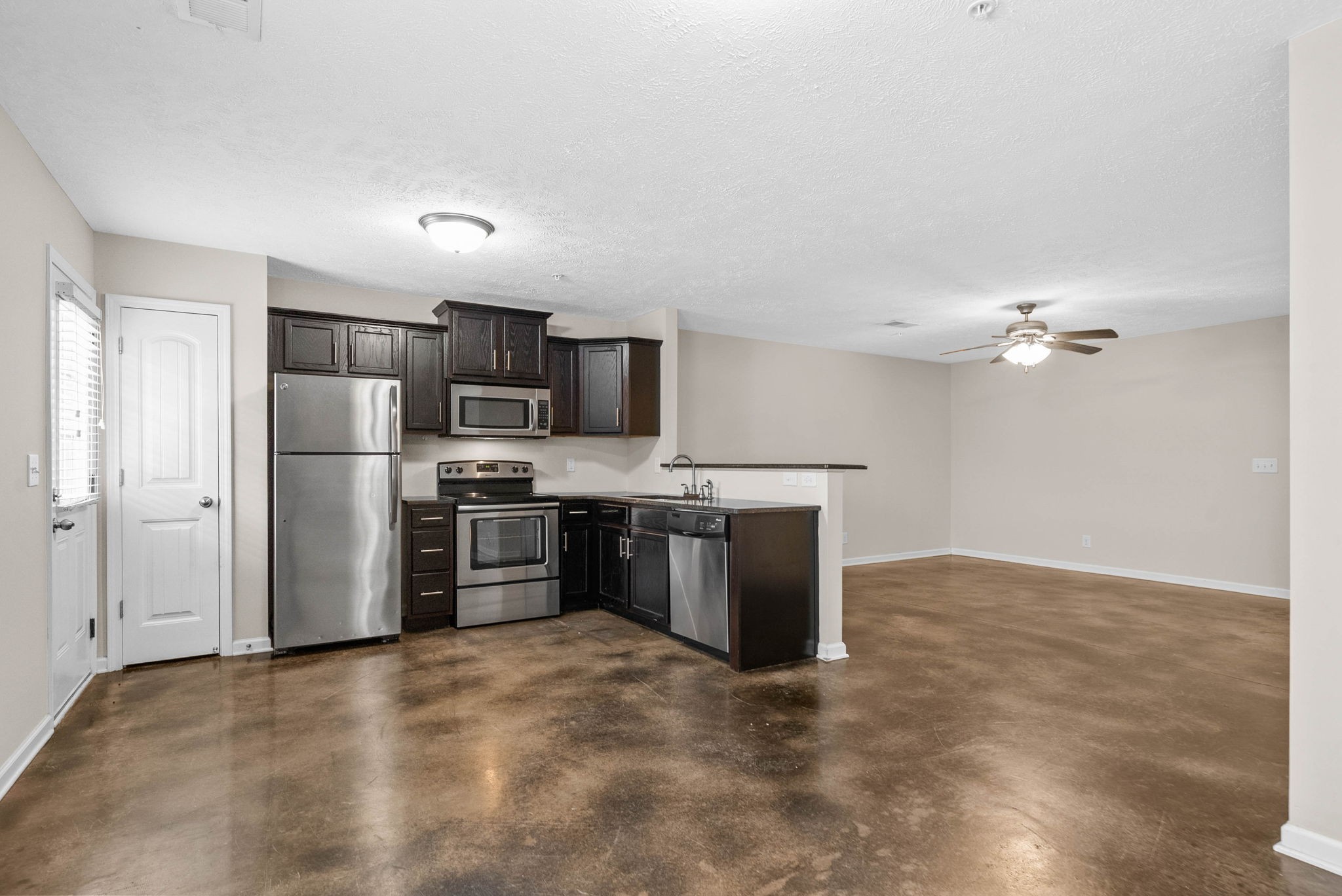 133 Melbourne Drive, Unit E Clarksville, TN 37043 - Photo 8 of 16 a kitchen with stainless steel appliances a refrigerator a stove a sink and dishwasher