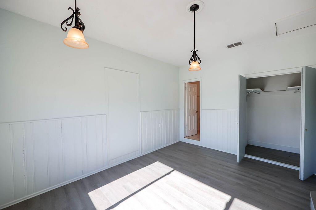 532 54th Street Lubbock, TX 79404 - Photo 8 of 19 a room view with a wooden floor and a ceiling fan