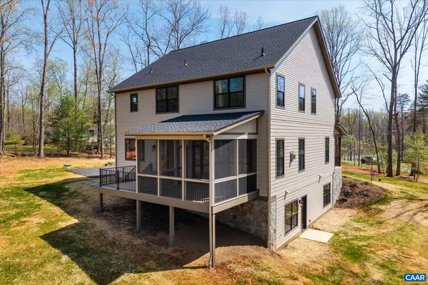 a spacious bathroom with a double vanity sink double mirror and bathtub