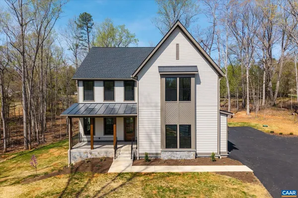 a view of a kitchen with a refrigerator and a kitchen counter top