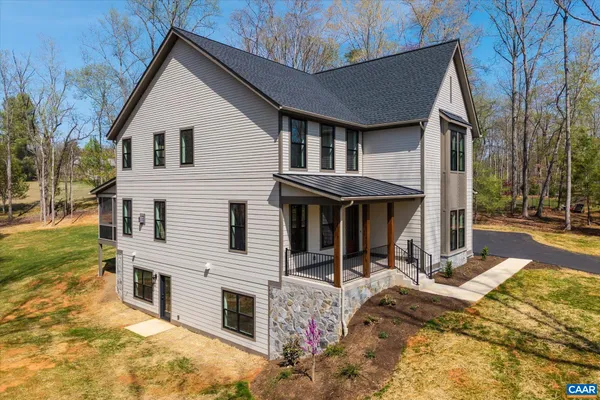 a kitchen with refrigerator cabinets and wooden floor