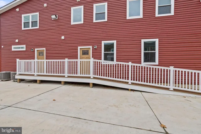 a view of a brick house with many windows