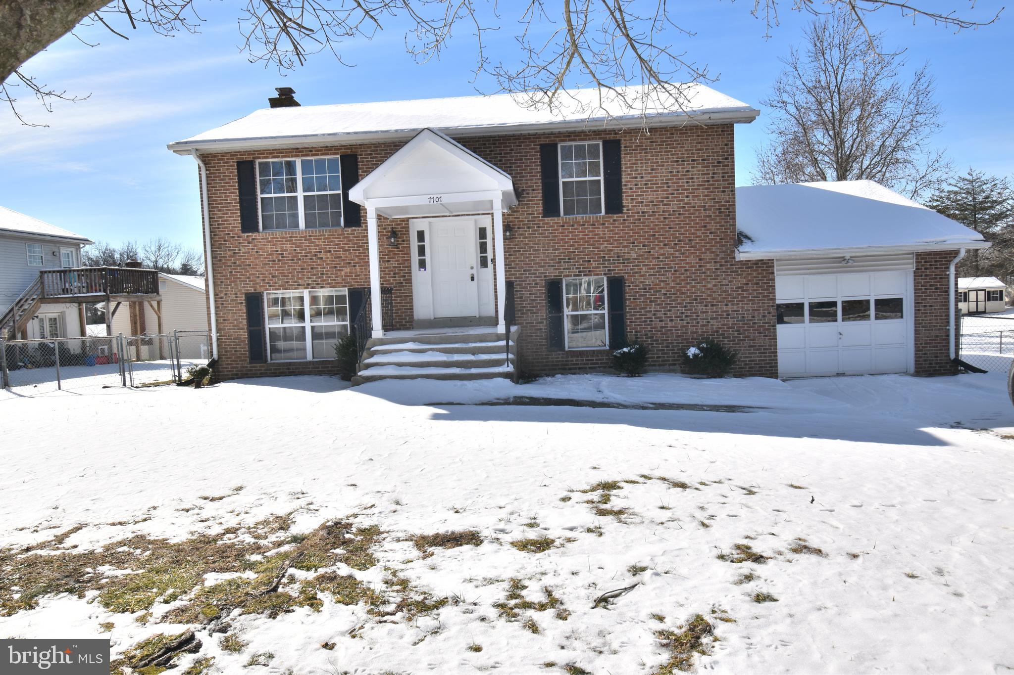 7707 Klovstad Drive Fort Washington, MD 20744 - Photo 2 of 15 a front view of a house with a yard