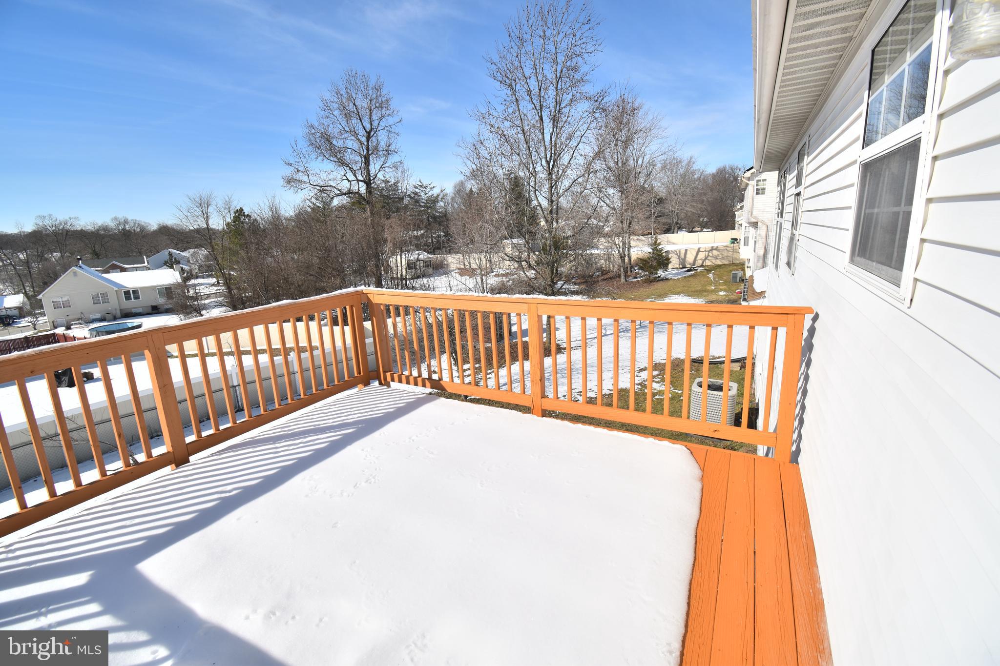 7707 Klovstad Drive Fort Washington, MD 20744 - Photo 4 of 15 a view of balcony with wooden floor and fence