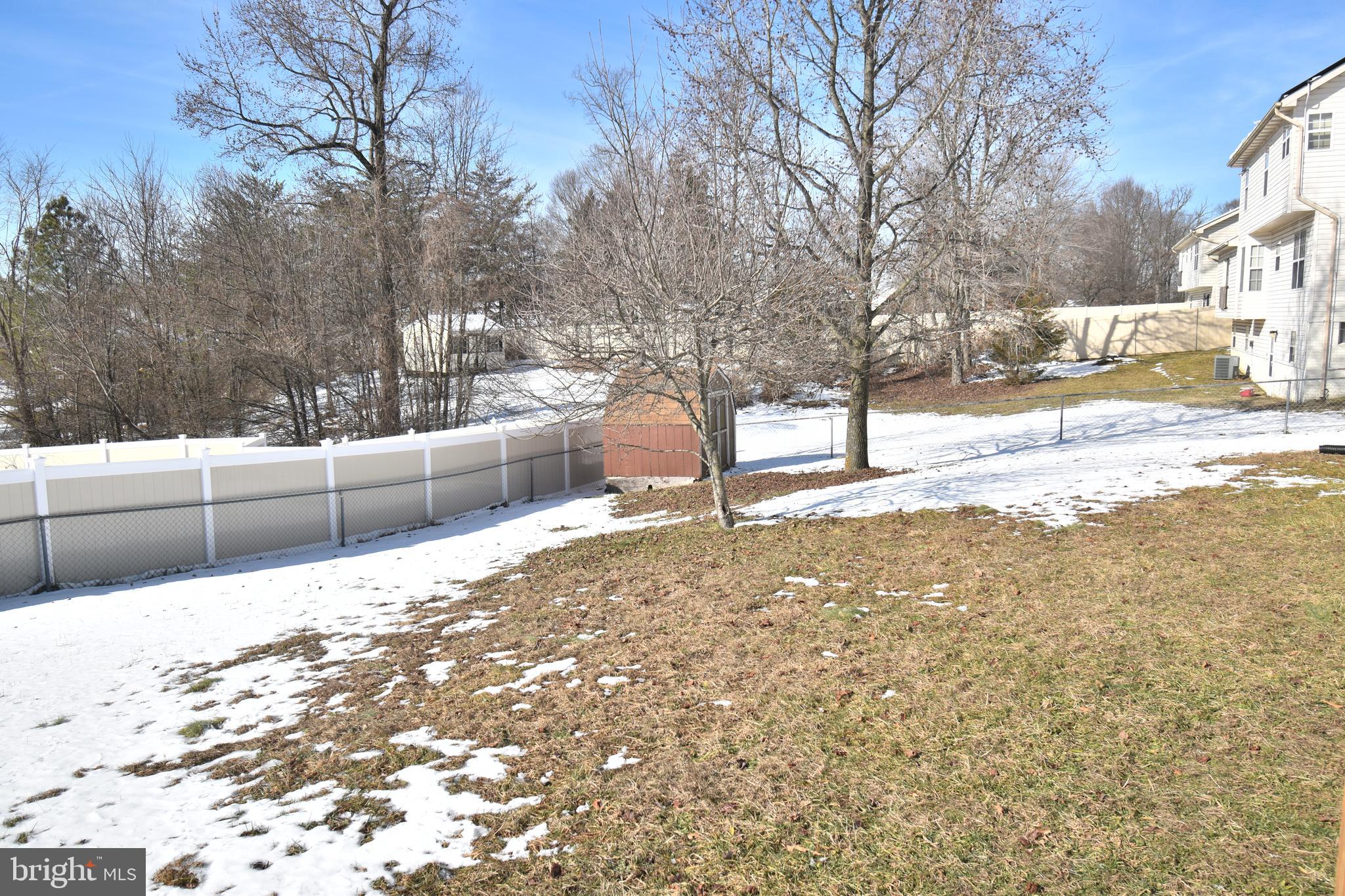 7707 Klovstad Drive Fort Washington, MD 20744 - Photo 5 of 15 a view of a yard with a snow on the road