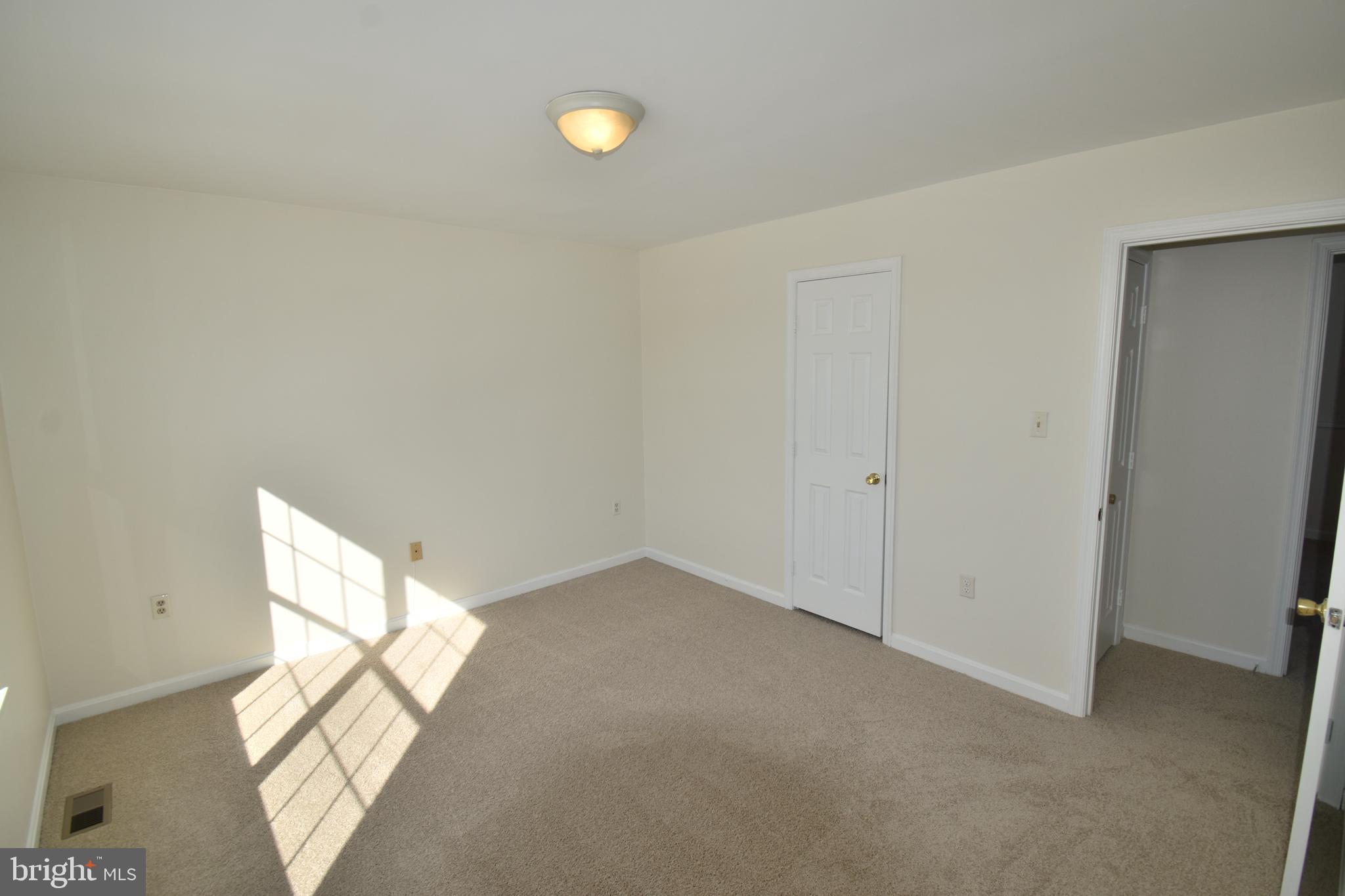 7707 Klovstad Drive Fort Washington, MD 20744 - Photo 9 of 15 a view of an empty room and a window