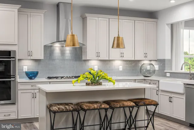 a kitchen with a stove a sink and a cabinets