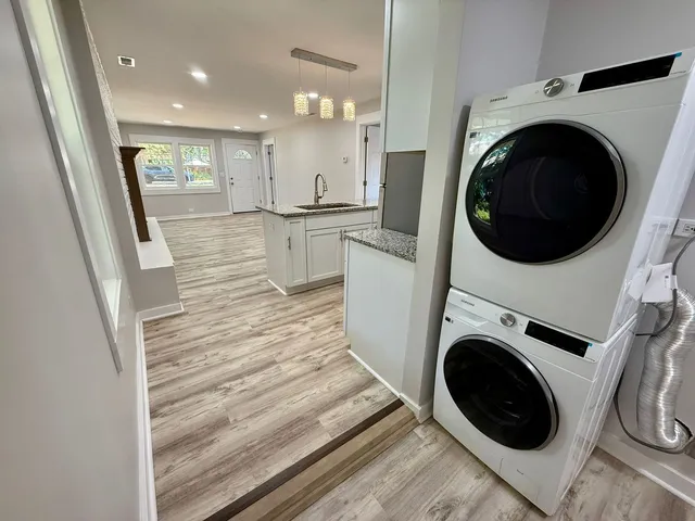 a view of a kitchen with washer and dryer