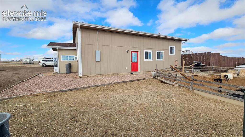 3835 Sengbeil Road Yoder, CO 80864 - Photo 9 of 48 a house with trees in the background