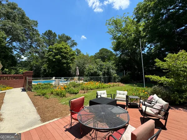 a view of a house with wooden deck