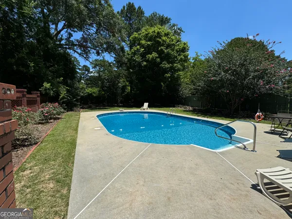 a view of a yard with an outdoor space