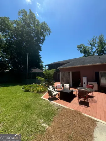 a kitchen with stainless steel appliances kitchen island granite countertop a refrigerator stove microwave and sink