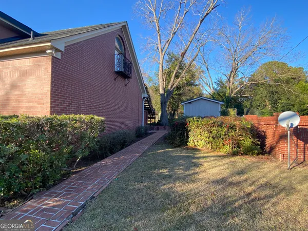 a white toilet sitting next to a shower curtain