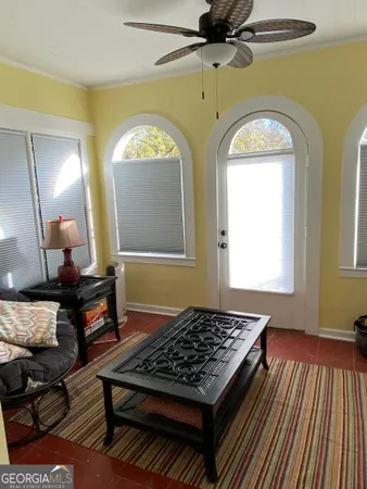 a living room with a couch and a dresser