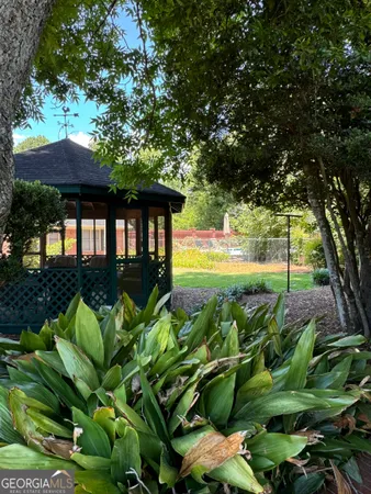a view of a backyard with furniture