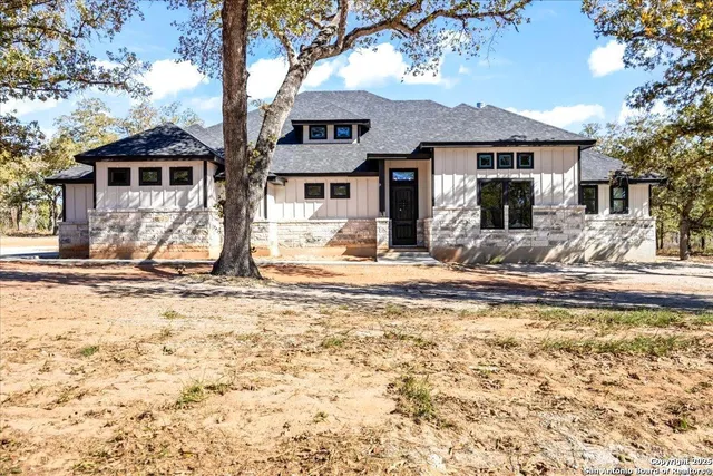 a view of a house with snow on the wall