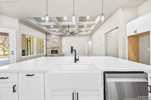 a view of a kitchen center island the sink appliances and living room