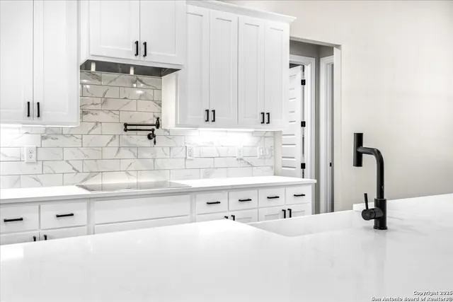 a bathroom with a bathtub and a sink