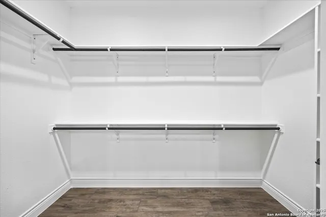 a view of an empty walk in closet