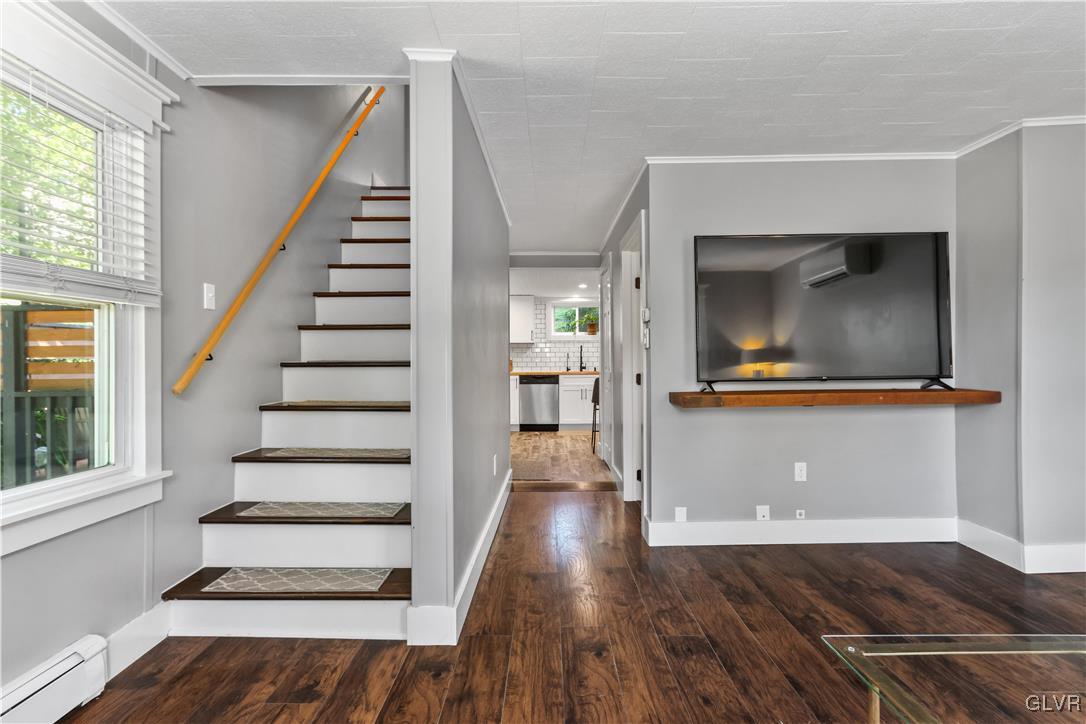389 West Nesquehoning Street Easton, PA 18042 - Photo 16 of 44 a view of a livingroom with wooden floor and stairs
