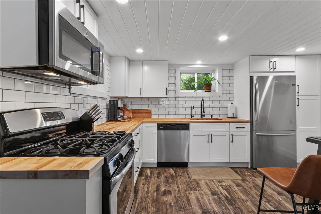 389 West Nesquehoning Street Easton, PA 18042 - Photo 17 of 44 a kitchen with a sink stove and refrigerator