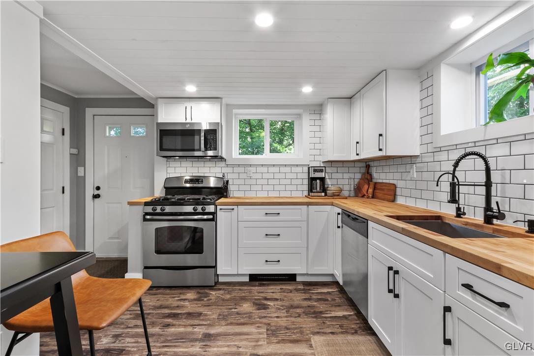 389 West Nesquehoning Street Easton, PA 18042 - Photo 18 of 44 a kitchen with a sink stove and cabinets