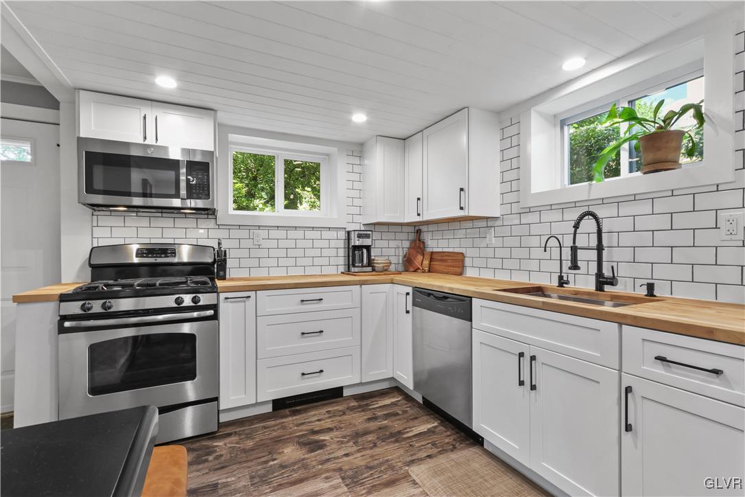 389 West Nesquehoning Street Easton, PA 18042 - Photo 20 of 44 a kitchen with a sink stove and microwave