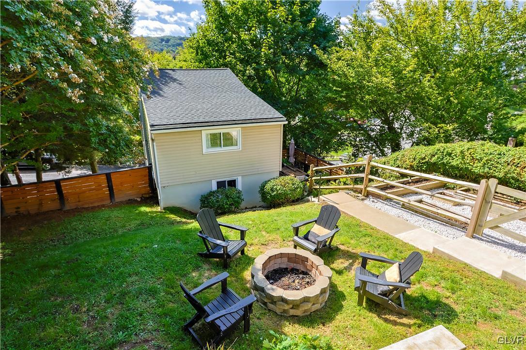 389 West Nesquehoning Street Easton, PA 18042 - Photo 2 of 44 a view of backyard of house with seating space and trees in the background
