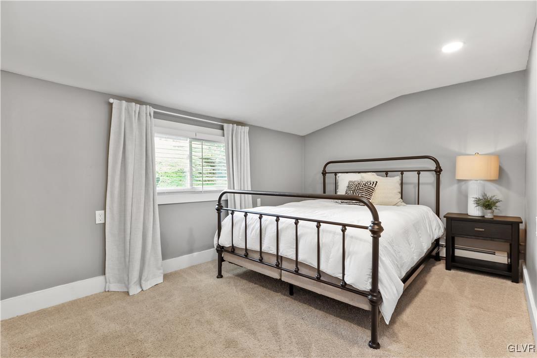 389 West Nesquehoning Street Easton, PA 18042 - Photo 32 of 44 a spacious bedroom with a bed and window