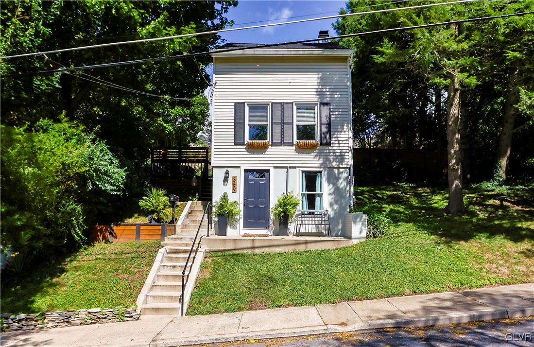 389 West Nesquehoning Street Easton, PA 18042 - Photo 41 of 44 a front view of a house with a garden