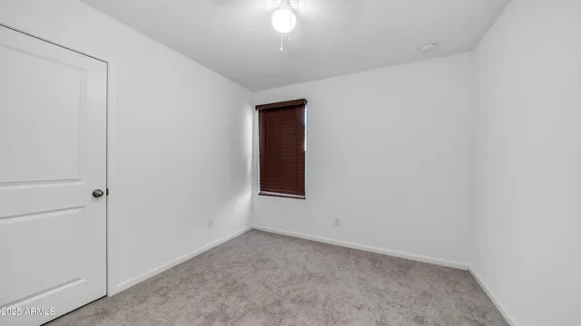 an empty room with a empty space and a window