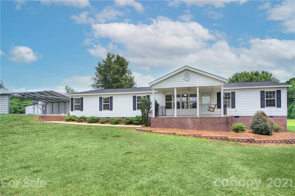 7918 Morgan Mill Road Monroe, NC 28110 - Photo 3 of 37 a front view of house with yard and green space