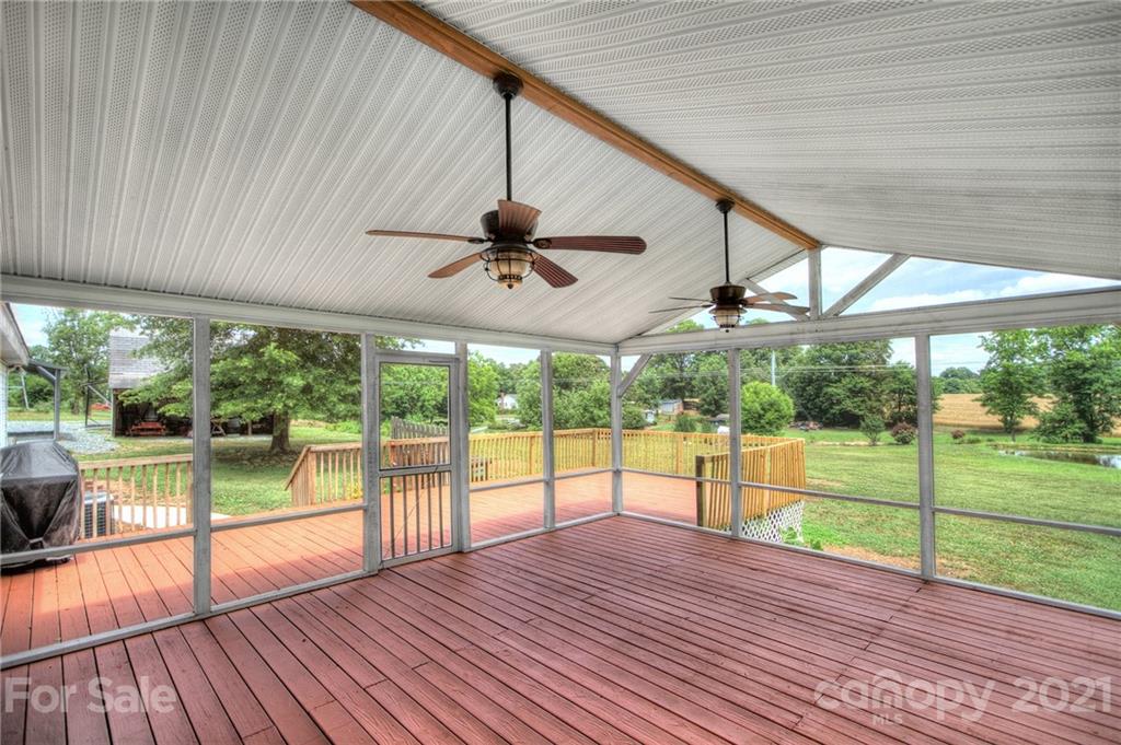7918 Morgan Mill Road Monroe, NC 28110 - Photo 25 of 37 an empty room with wooden floor and windows