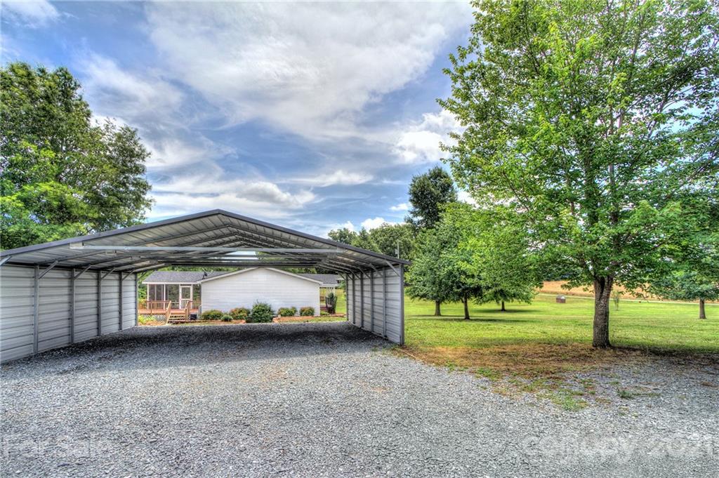 7918 Morgan Mill Road Monroe, NC 28110 - Photo 30 of 37 a front view of a house with a yard and trees