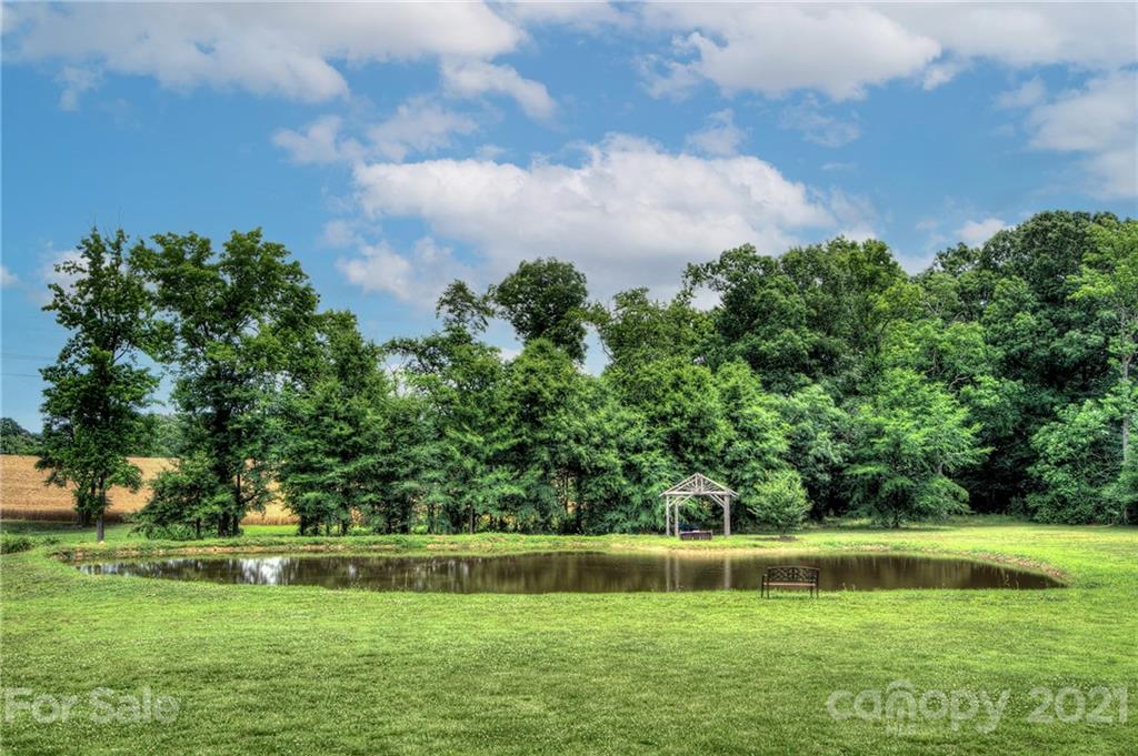 7918 Morgan Mill Road Monroe, NC 28110 - Photo 34 of 37 a view of yard with swimming pool and green space
