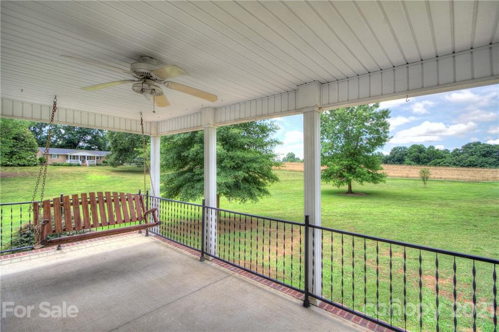 7918 Morgan Mill Road Monroe, NC 28110 - Photo 6 of 37 a view of a patio with a yard