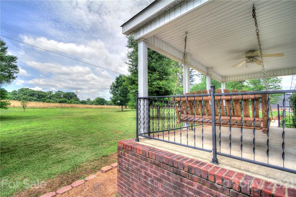 7918 Morgan Mill Road Monroe, NC 28110 - Photo 7 of 37 a view of a backyard with a garden