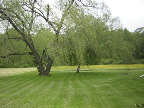 288 Hunter Forge Road Macungie, PA 18062 - Photo 18 of 18 a view of outdoor space with a garden and trees
