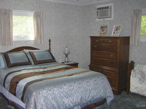 288 Hunter Forge Road Macungie, PA 18062 - Photo 9 of 18 a bedroom with a bed and cabinet