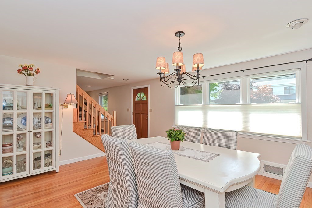 51 Albert Road Newton, MA 02466 - Photo 12 of 40 a dining room with furniture a chandelier and wooden floor