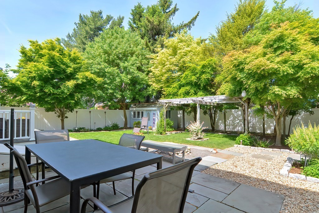 51 Albert Road Newton, MA 02466 - Photo 34 of 40 a backyard of a house with table and chairs